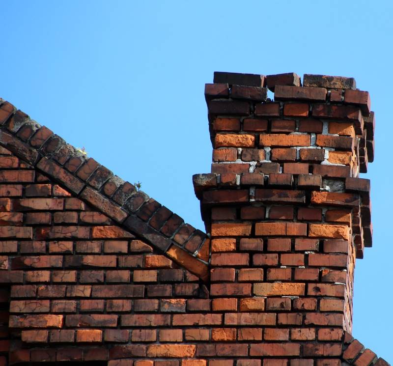 Signs Your Wayne Home Needs a Chimney Inspection Damaged chimney on an Wayne home showing cracks and missing mortar